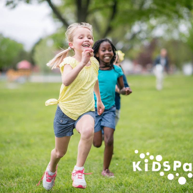 Children enjoying outdoor activities at KidSpark's summer camp, creating memorable experiences