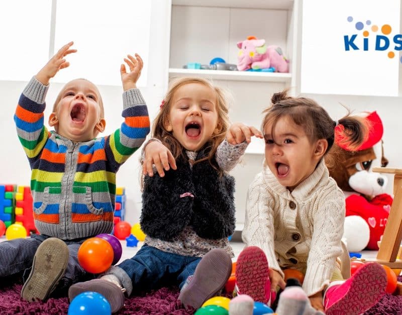 Three toddlers having fun at KidsPark, a daycare/ child care in California