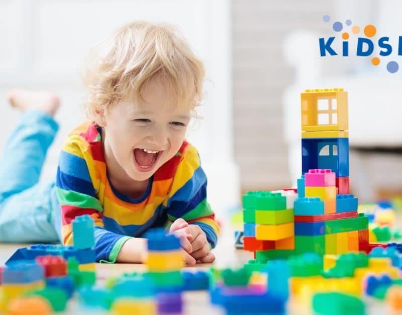 Little boy playing with blocks at KidsPark, childcare in California